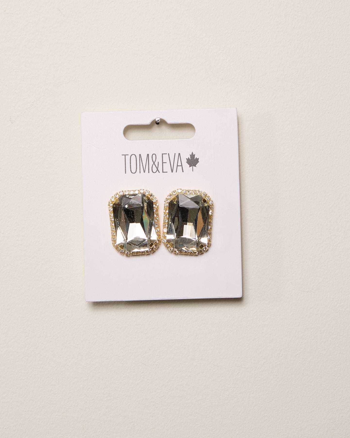 Boucles d’oreilles grande pierre avec bordure de diamants dorées