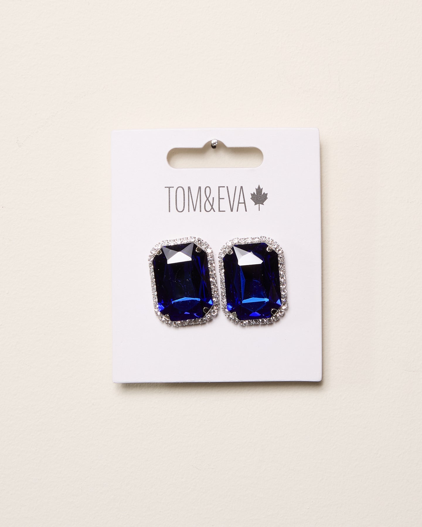 Boucles d’oreilles grande pierre avec bordure de diamants bleus