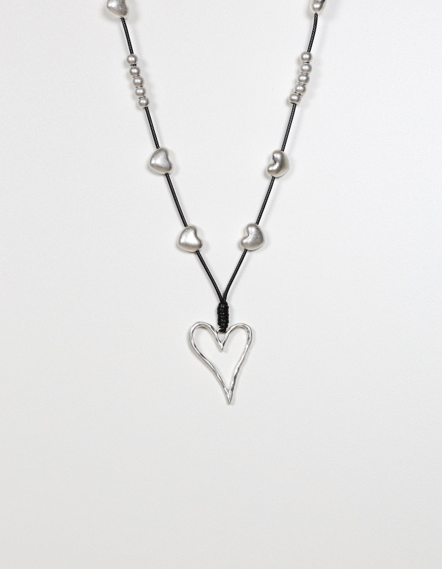 Silver Cord Necklace with Layered Heart and Ball Details